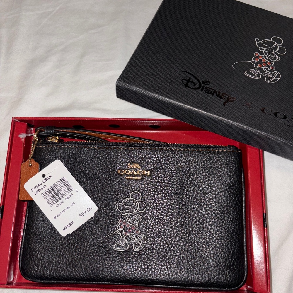 Coach x Disney Minnie Mouse small black leather pouch. New with tags and box.